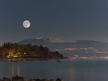 Scenic view of sea against sky at night