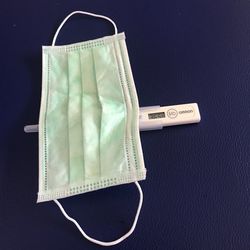 High angle view of telephone on table against blue background