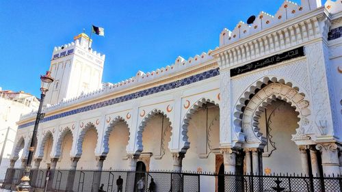 Low angle view of historical building against blue sky