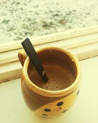 High angle view of coffee on window sill