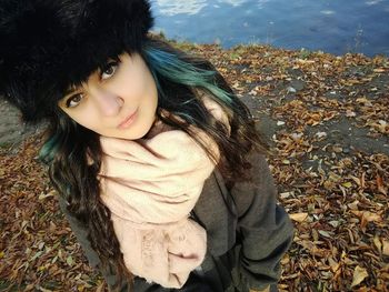 Portrait of beautiful woman in field during autumn