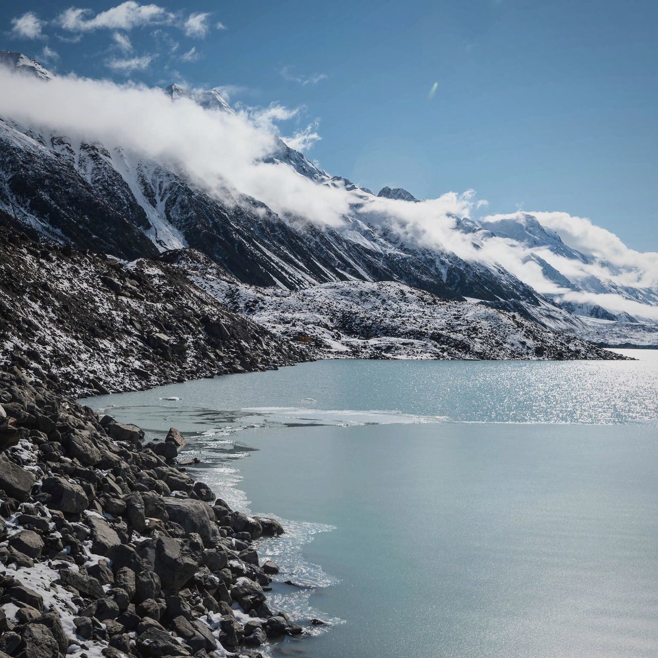 snow, winter, cold temperature, mountain, mountain range, snowcapped mountain, season, tranquil scene, scenics, tranquility, beauty in nature, weather, nature, landscape, sky, frozen, water, lake, non-urban scene, covering