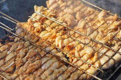 Close-up of meat on barbecue grill