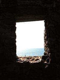 View of sea through window