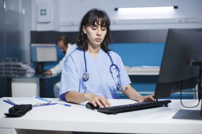 Portrait of businesswoman working at clinic