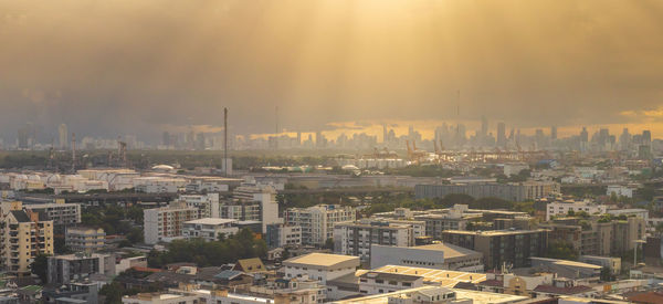 High angle view of buildings in city against sky