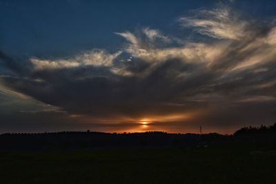 Scenic view of dramatic sky over landscape