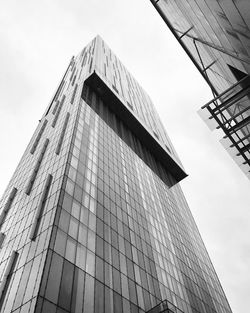 Low angle view of skyscraper against sky