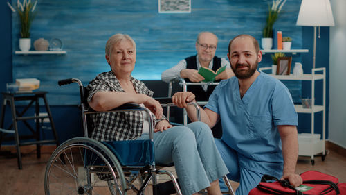 Portrait of doctor sitting on wheelchair