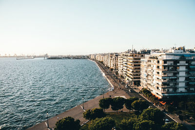 Scenic view of city by the sea