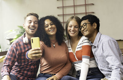 Young man and woman using smart phone