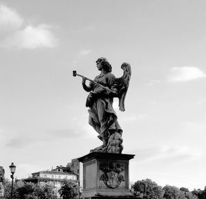 Low angle view of statue against sky