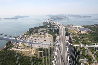 High angle view of seto large bridge and cityscape against sky