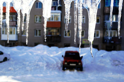 Close-up of snow on car during winter