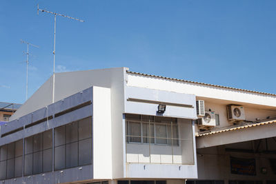 Low angle view of building against clear blue sky