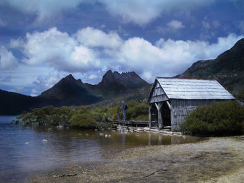 Scenic view of lake and mountains against sky