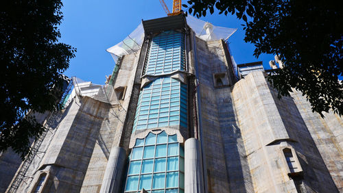 Low angle view of building against clear blue sky