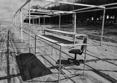 Empty chairs on beach