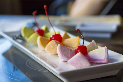 Close-up of fruits in plate on table