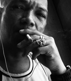 Portrait of man smoking cigarette