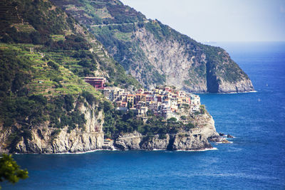 View of village on cliffs next to sea