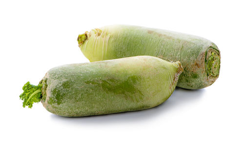 Close-up of green pepper against white background