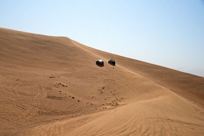 Scenic view of desert against clear sky