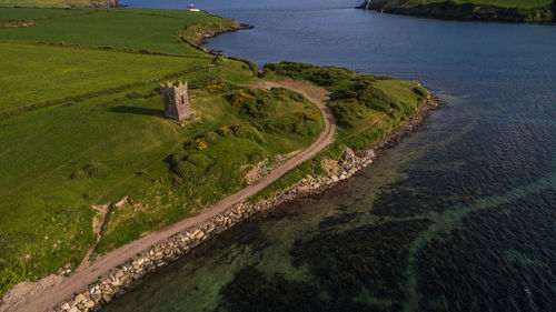 High angle view of agricultural field by sea