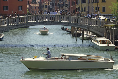 Man traveling in boat on river