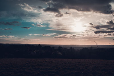 Scenic view of silhouette landscape against sky during sunset