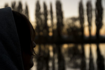 Close-up rear view of man in lake