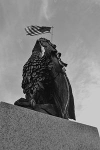 Low angle view of statue against sky