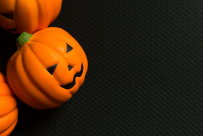 Close-up of pumpkin on orange surface
