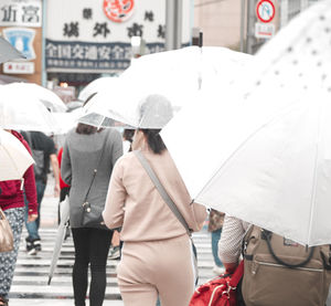 People walking on street in rainy season