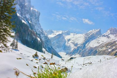 Scenic view of mountains against sky during winter