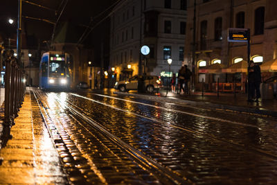 View of wet railroad station at night