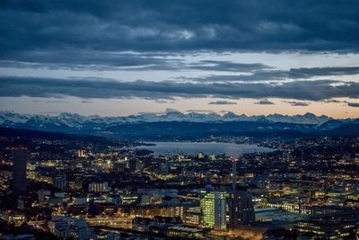 High angle view of illuminated cityscape against sky