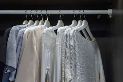 Clothes hanging on rack in store