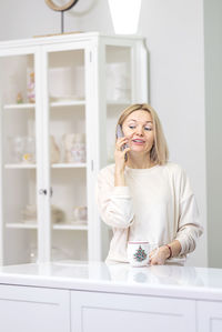 Young woman sitting at home