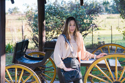 Beautiful woman wearing leather bag