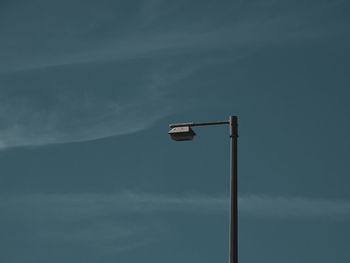 Low angle view of street light against sky