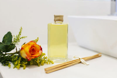 Close-up of yellow rose on table