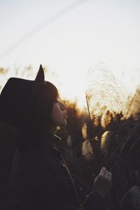 Portrait of woman against sky during sunset