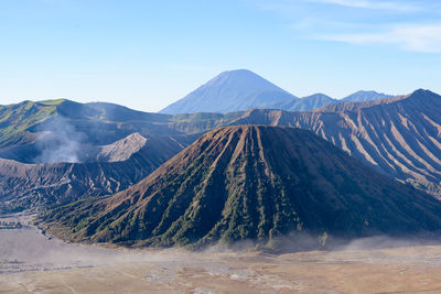 Panoramic view of volcanic landscape against sky