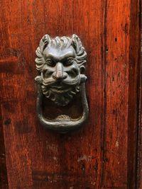 Close-up of statue on wooden door