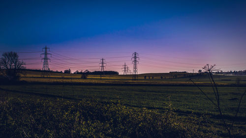 Scenic view of field against clear blue sky
