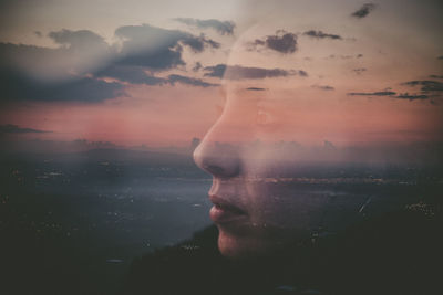 Portrait of young man in sea against sky during sunset