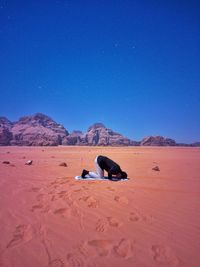 Muslim praying in desert