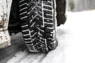 Close-up of tire tracks in snow