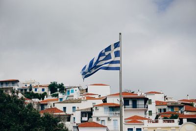 Low angle view of flag against sky